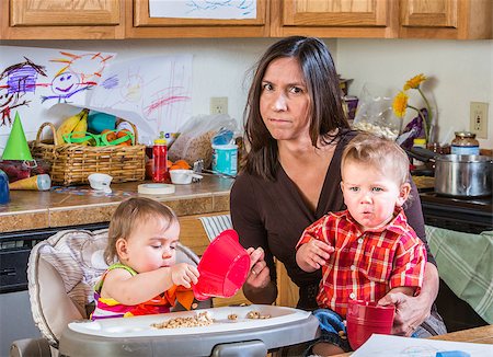 Stressed out mother in kitchen with her babies Stock Photo - Budget Royalty-Free & Subscription, Code: 400-07682082