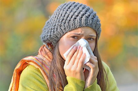 girl blowing nose in autumn background Stock Photo - Budget Royalty-Free & Subscription, Code: 400-07682461