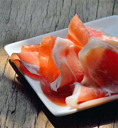 simsearch:400-06207145,k - slices of Prosciutto di Parma on plate Stock Photo - Budget Royalty-Free & Subscription, Code: 400-07682462