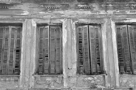 simsearch:400-04356946,k - Broken wooden window shutters and textured wall of an abandoned house. Urban decay black and white. Stock Photo - Budget Royalty-Free & Subscription, Code: 400-07682733
