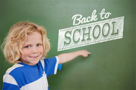 school child graphics - Composite image of back to school message against cute pupil pointing Stock Photo - Budget Royalty-Free & Subscription, Code: 400-07683176