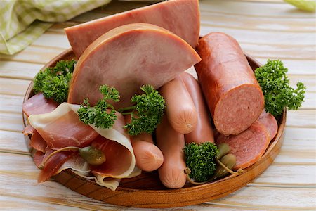 simsearch:400-04885499,k - various kinds of sausages and smoked bacon on the wooden plate Stock Photo - Budget Royalty-Free & Subscription, Code: 400-07714024