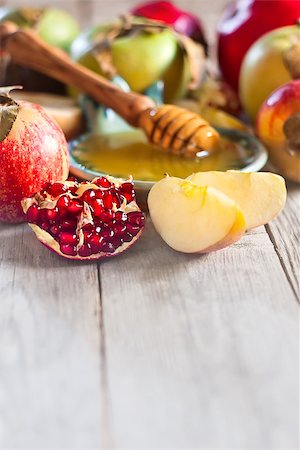 simsearch:400-06069331,k - Pomegranate, apple and honey, traditional food of jewish New Year celebration, Rosh Hashana. Selective focus. Copyspace background Stock Photo - Budget Royalty-Free & Subscription, Code: 400-07719954