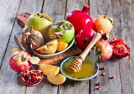 simsearch:400-07329068,k - Pomegranate, apple and honey, traditional food of jewish New Year celebration, Rosh Hashana. Selective focus. Stock Photo - Budget Royalty-Free & Subscription, Code: 400-07719950