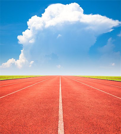 simsearch:400-04785051,k - red running track over blue sky and clouds Stock Photo - Budget Royalty-Free & Subscription, Code: 400-07719997