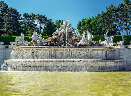 simsearch:400-07681663,k - The neptune fountain at the Schonbrunn Palace in Vienna, Austria Stock Photo - Budget Royalty-Free & Subscription, Code: 400-07713744