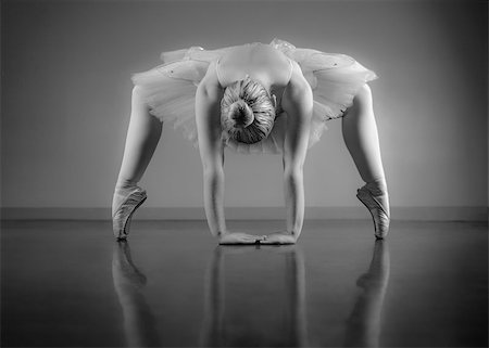 simsearch:400-07725556,k - Graceful ballerina warming up in black and white in the ballet studio Stock Photo - Budget Royalty-Free & Subscription, Code: 400-07725591