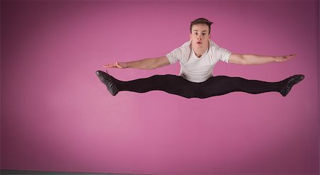 simsearch:400-07725556,k - Focused male ballet dancer leaping doing the splits in the dance studio Stock Photo - Budget Royalty-Free & Subscription, Code: 400-07725614