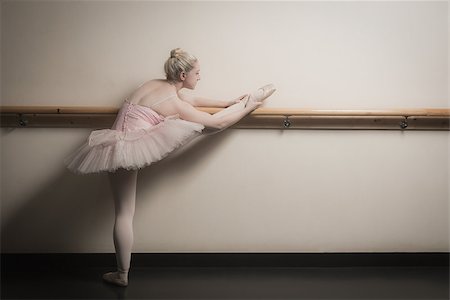 simsearch:400-07725556,k - Beautiful ballerina warming up with the barre in the dance studio Stock Photo - Budget Royalty-Free & Subscription, Code: 400-07725626