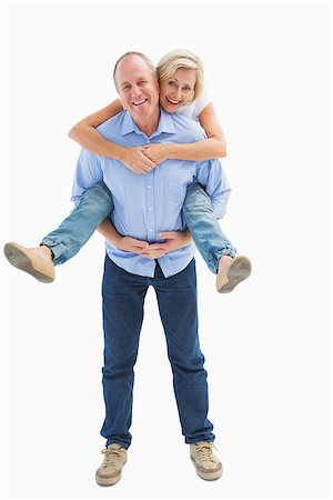 Mature man carrying his partner on his back on white background Stock Photo - Budget Royalty-Free & Subscription, Code: 400-07726567