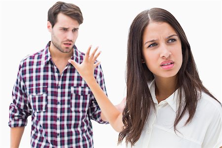 Angry brunette not listening to her boyfriend on white background Stock Photo - Budget Royalty-Free & Subscription, Code: 400-07726745