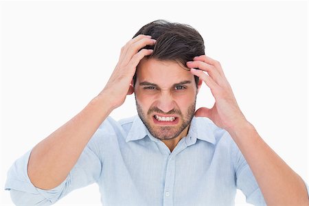 Stressed man looking at camera on white background Stock Photo - Budget Royalty-Free & Subscription, Code: 400-07726916