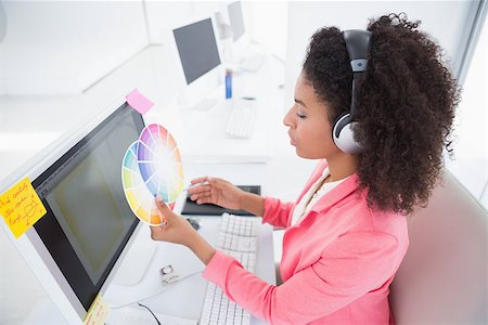 Casual graphic designer working at her desk in her office Stock Photo - Budget Royalty-Free & Subscription, Code: 400-07727610