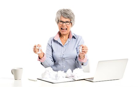 simsearch:400-07221782,k - Stressed elderly woman working in the office with a laptop Stock Photo - Budget Royalty-Free & Subscription, Code: 400-07720540