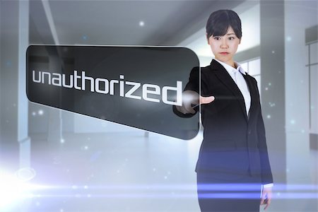 Businesswoman pointing to word unauthorized against screen in room with sparks Stock Photo - Budget Royalty-Free & Subscription, Code: 400-07721067