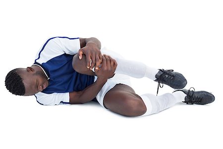 shin - Football player lying down injured on white background Stock Photo - Budget Royalty-Free & Subscription, Code: 400-07721759