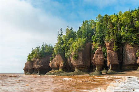 Famous Hopewell Rocks flowerpot formations at low tide (New Brunswick, Canada) Stock Photo - Budget Royalty-Free & Subscription, Code: 400-07749054