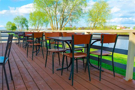 european style of coffee shop - Empty tables in a cafe by the river Stock Photo - Budget Royalty-Free & Subscription, Code: 400-07749512