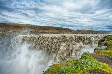 Dettifoss is the most powerful waterfall on Iceland and in the whole Europe. It is located in Jokulsargljufur National Park the northeasten Iceland on the river Jokulsa a Fjollum. Stock Photo - Budget Royalty-Free & Subscription, Code: 400-07756746