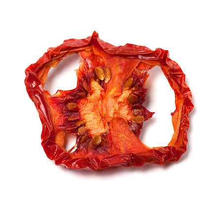 dehydrated - Dried slice of tomato. Isolated on white background. Close-up view. Stock Photo - Budget Royalty-Free & Subscription, Code: 400-07757125