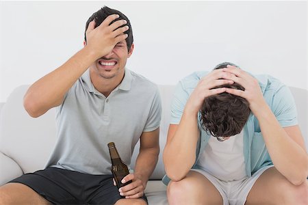 simsearch:628-05817772,k - View of two disappointed soccer fans watching tv Stock Photo - Budget Royalty-Free & Subscription, Code: 400-07750639