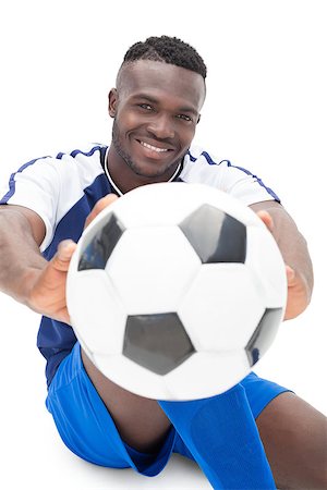 Portrait of a smiling football player over white background Stock Photo - Budget Royalty-Free & Subscription, Code: 400-07750647