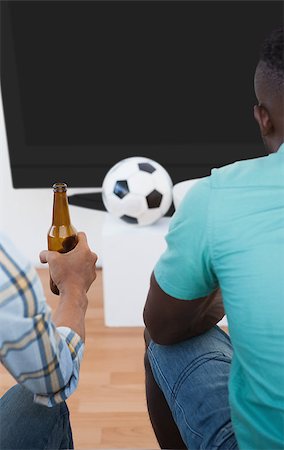 simsearch:628-05817772,k - Rear view of two soccer fans watching tv Stock Photo - Budget Royalty-Free & Subscription, Code: 400-07750802