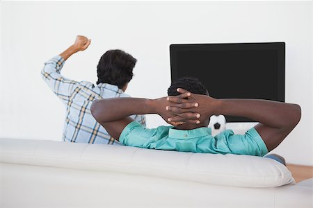 simsearch:628-05817772,k - Rear view of two soccer fans watching tv Stock Photo - Budget Royalty-Free & Subscription, Code: 400-07750803