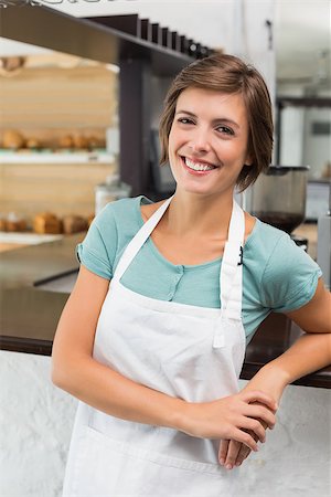 simsearch:400-07750853,k - Pretty barista smiling at camera at the coffee shop Stock Photo - Budget Royalty-Free & Subscription, Code: 400-07750841