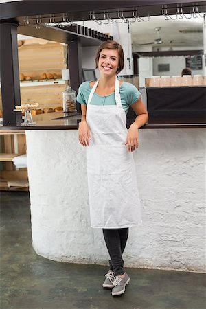simsearch:400-07750853,k - Pretty barista smiling at camera at the coffee shop Stock Photo - Budget Royalty-Free & Subscription, Code: 400-07750842