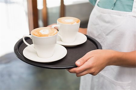 simsearch:400-07750853,k - Waitress holding tray with cappuccinos at the coffee shop Stock Photo - Budget Royalty-Free & Subscription, Code: 400-07750850