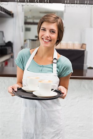 simsearch:400-07750853,k - Waitress holding tray with cappuccinos at the coffee shop Stock Photo - Budget Royalty-Free & Subscription, Code: 400-07750851