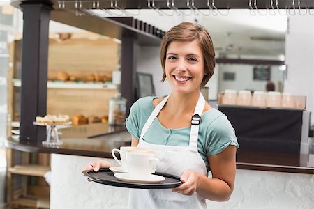 simsearch:400-07750853,k - Waitress holding tray with cappuccinos at the coffee shop Stock Photo - Budget Royalty-Free & Subscription, Code: 400-07750852