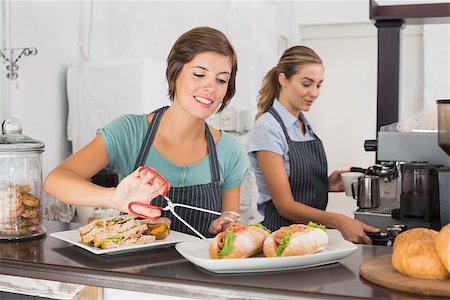 simsearch:400-07750853,k - Pretty waitresses working with a smile at the coffee shop Stock Photo - Budget Royalty-Free & Subscription, Code: 400-07750907