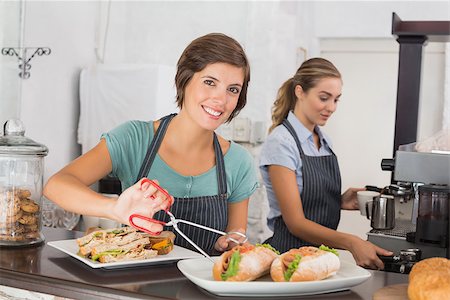 simsearch:400-07750853,k - Pretty waitresses working with a smile at the coffee shop Stock Photo - Budget Royalty-Free & Subscription, Code: 400-07750908