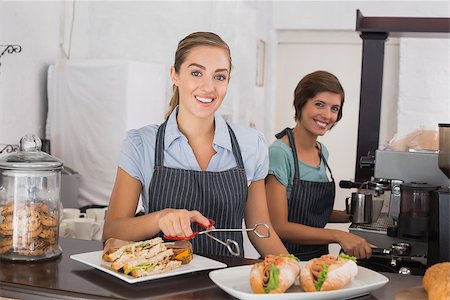 simsearch:400-07750853,k - Pretty waitresses working with a smile at the coffee shop Stock Photo - Budget Royalty-Free & Subscription, Code: 400-07750909