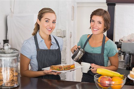 simsearch:400-07750853,k - Pretty waitresses working with a smile at the coffee shop Stock Photo - Budget Royalty-Free & Subscription, Code: 400-07750914