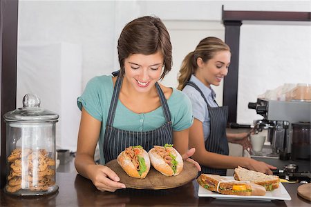 simsearch:400-07750853,k - Pretty waitresses working with a smile at the coffee shop Stock Photo - Budget Royalty-Free & Subscription, Code: 400-07750916
