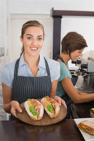simsearch:400-07750853,k - Pretty waitresses working with a smile at the coffee shop Stock Photo - Budget Royalty-Free & Subscription, Code: 400-07750917