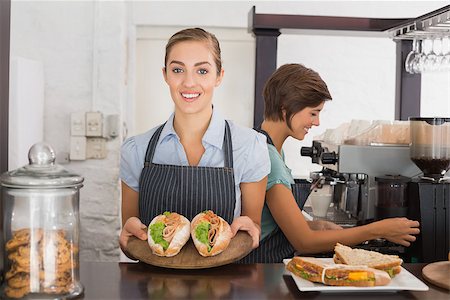 simsearch:400-07750853,k - Pretty waitresses working with a smile at the coffee shop Stock Photo - Budget Royalty-Free & Subscription, Code: 400-07750918