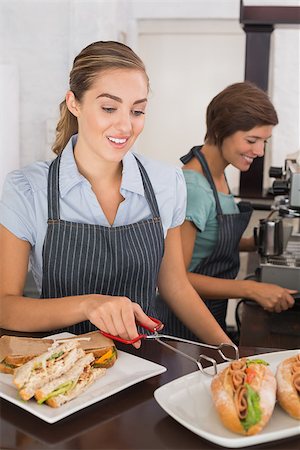 simsearch:400-07750853,k - Pretty waitresses working with a smile at the coffee shop Stock Photo - Budget Royalty-Free & Subscription, Code: 400-07750911