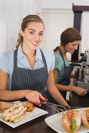 simsearch:400-07750853,k - Pretty waitresses working with a smile at the coffee shop Stock Photo - Budget Royalty-Free & Subscription, Code: 400-07750912