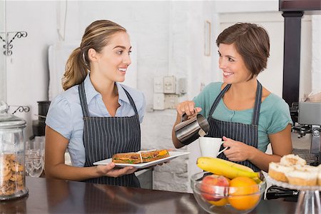 simsearch:400-07750853,k - Pretty waitresses working with a smile at the coffee shop Stock Photo - Budget Royalty-Free & Subscription, Code: 400-07750913