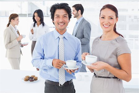 Business people enjoying their drinks while chatting Stock Photo - Budget Royalty-Free & Subscription, Code: 400-07751846