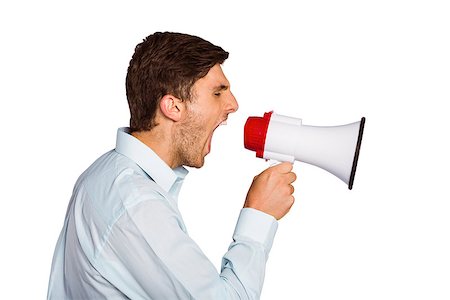 Young man shouting through megaphone on white background Stock Photo - Budget Royalty-Free & Subscription, Code: 400-07753356