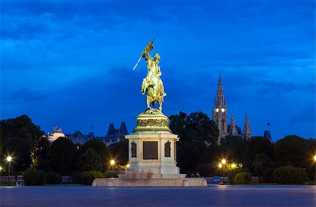 Monument dedicated to Archduke Charles of Austria (Erzherzog Karl) ridding a horse and the city hall (Rathause) in Vienna, Austria. Stock Photo - Budget Royalty-Free & Subscription, Code: 400-07774694