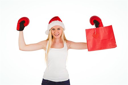 Festive blonde cheering with boxing gloves on white background Photographie de stock - Aubaine LD & Abonnement, Code: 400-07778963