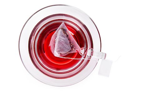 simsearch:400-04273561,k - Red fruit tea in transparent glass cup with tea bag with blank label, top view isolated on white background with clipping path. Healthy tea drinking. Stock Photo - Budget Royalty-Free & Subscription, Code: 400-07771421