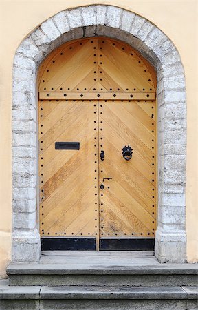 simsearch:400-07257534,k - Ancient wooden door design in old city in Tallinn, Estonia Stock Photo - Budget Royalty-Free & Subscription, Code: 400-07771502