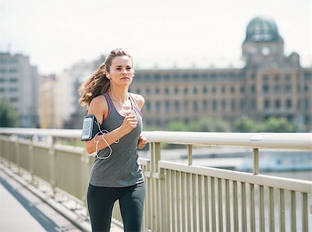 Fitness young woman jogging in the city Stock Photo - Budget Royalty-Free & Subscription, Code: 400-07794002